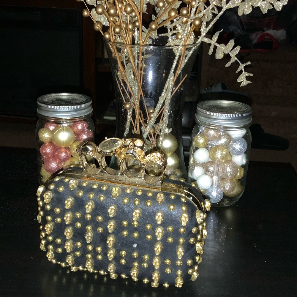 Skull Candy Black  & gold knuckle clutch
